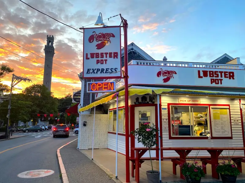 Lobster Pot Express at sunset with the Pilgrim Monument behind