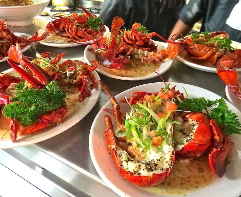 Split lobsters served in garlic butter